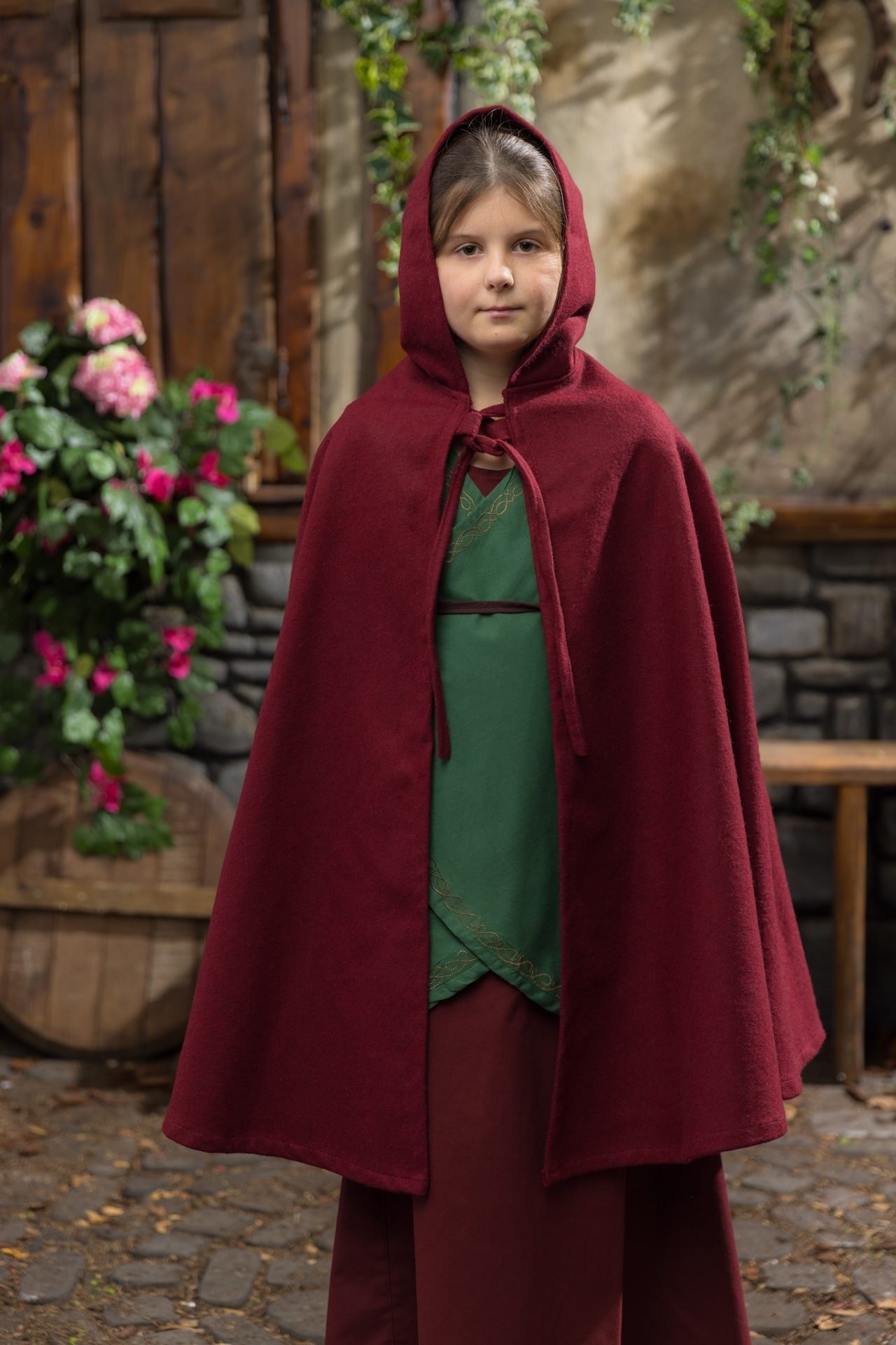 Red Burgschneider Leanaa children&rsquo;s cape available at The Clothier&rsquo;s House.